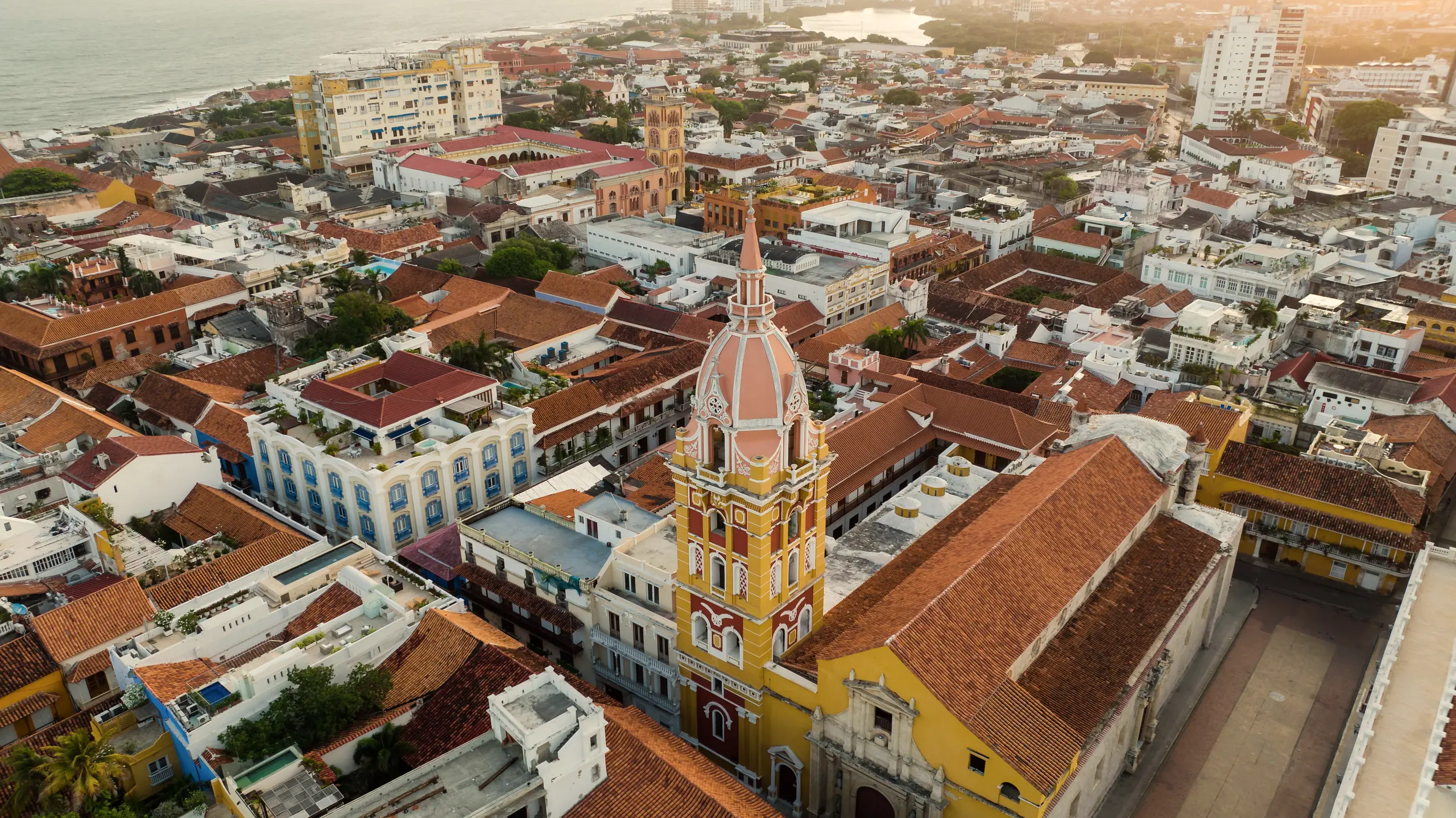 Aerial view of the historic center with rooftops and a yellow tower