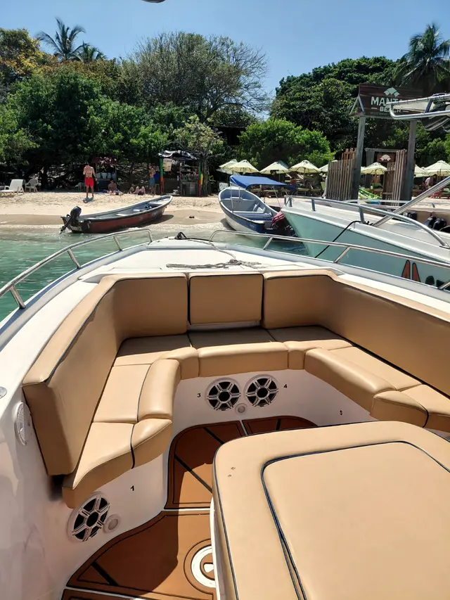 Bow seating with an island beach behind